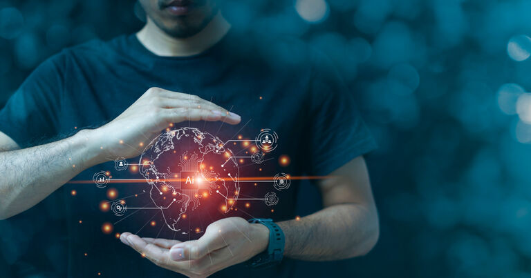 A person - whose face is obscured - holds a world in their hands. In the center of this world reads "AI," and the world itself is made out of computer code and digital elements.